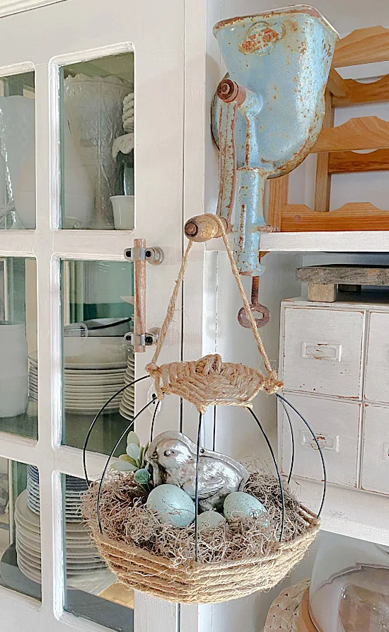 basket with eggs hanging on hutch