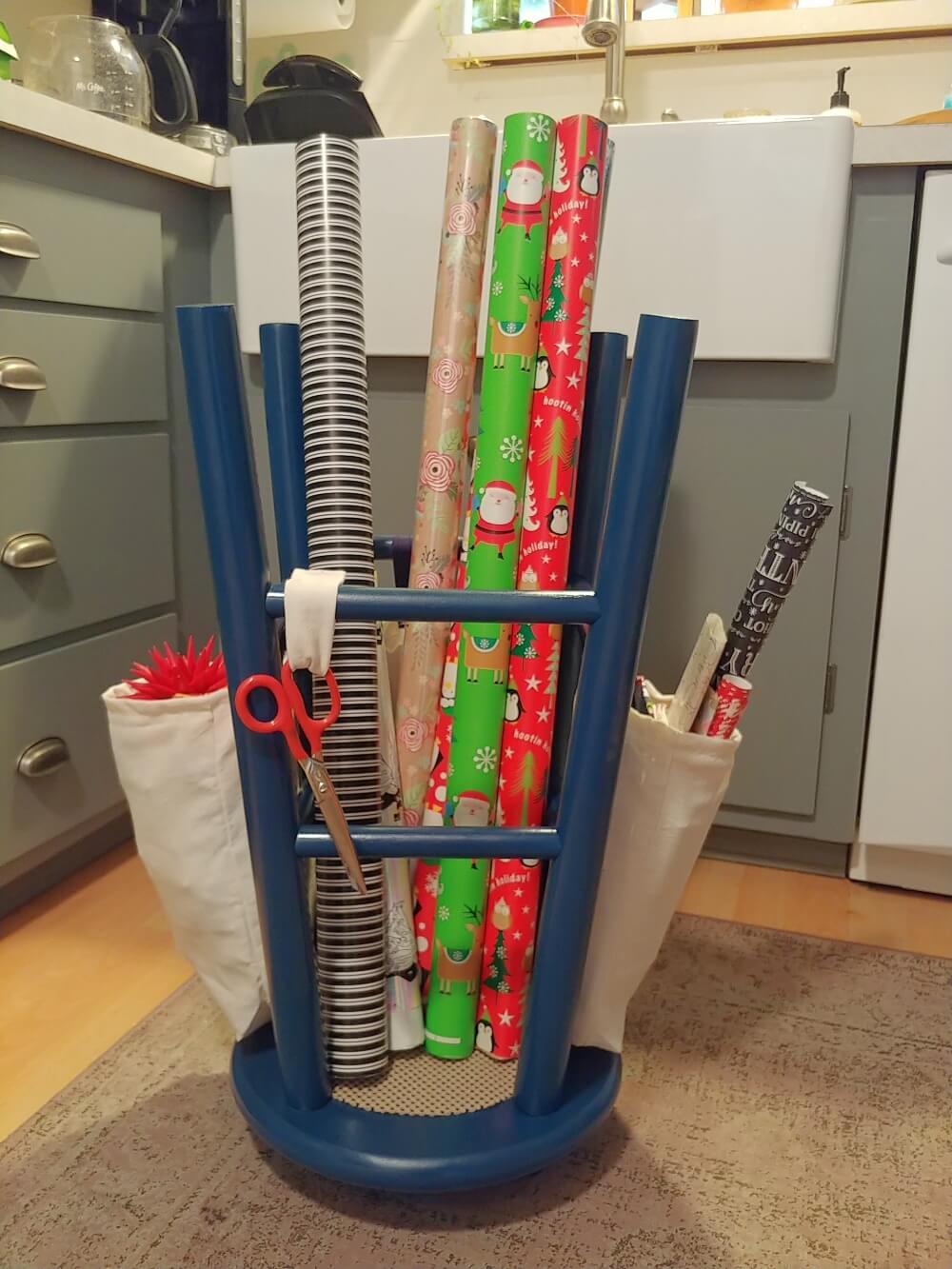 Vertical Wrapping Paper Storage from a Wood Counter Stool