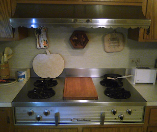 Photo showing vintage Chambers In-A-Counter cooktop with vintage range hood in a modern kitchen