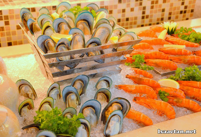 Fresh oysters and prawns on ice to tempt our taste buds Fresh oysters and prawns on ice to tempt our taste buds