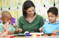 Teacher with two young students