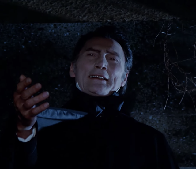 Jack Palance as Dracula holding his hand out to the viewer