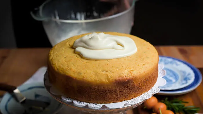 Spread creme fraiche frosting onto cooled down kumquat cake.