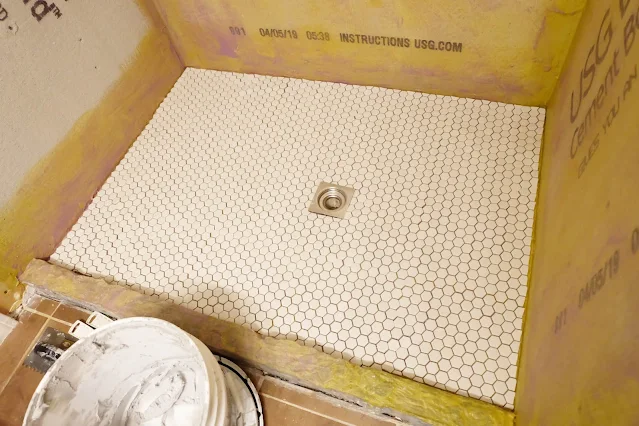 dry fitting mosaic tile on shower floor