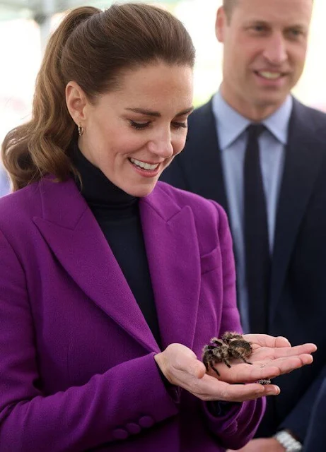 Kate Middleton wore a purple suit by Emilia Wickstead. Emmy London Josie pumps and Jaeger quilted bag