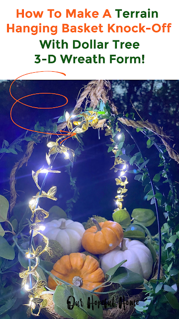orange white pumpkins hanging globe wire basket fairy lights