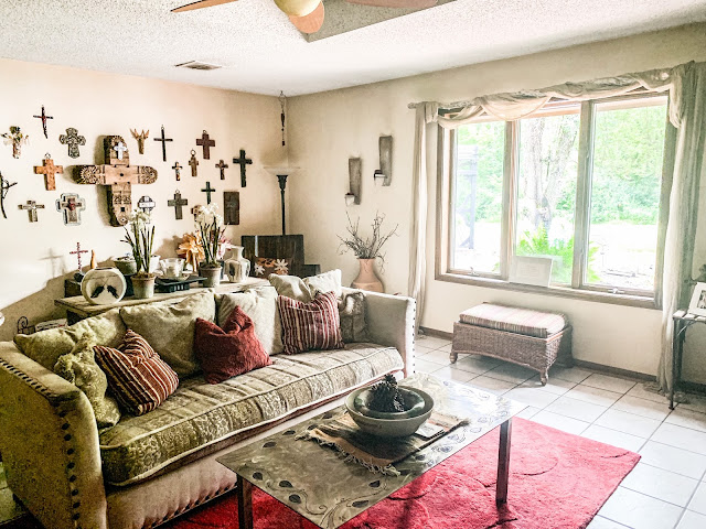 gallery wall with crosses in rustic living room 