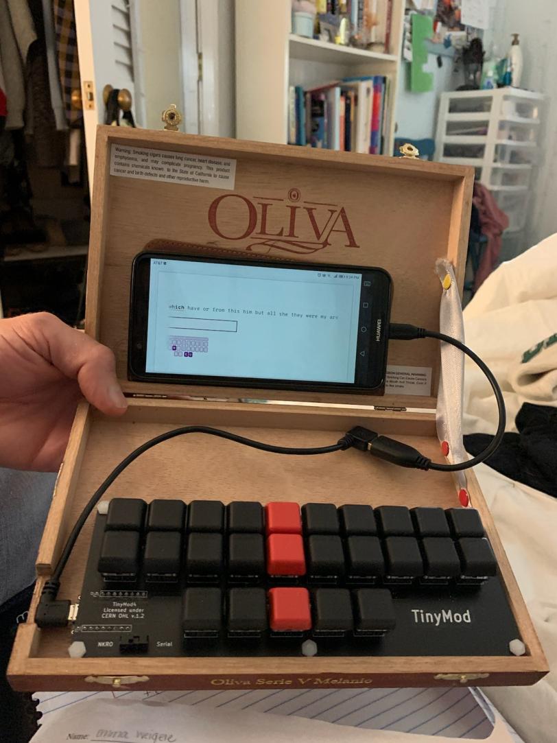 a cigar box with a TinyMod and an Android phone showing Typey Type for Stenographers