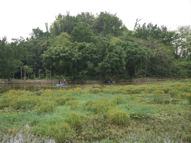 people on boats at Panlong Lake