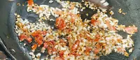 Sauteing tomatoes with onions cumin and garlic for palak paneer recipe