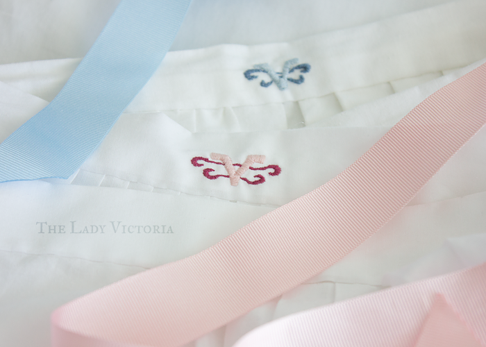 blue and pink embroidered monograms