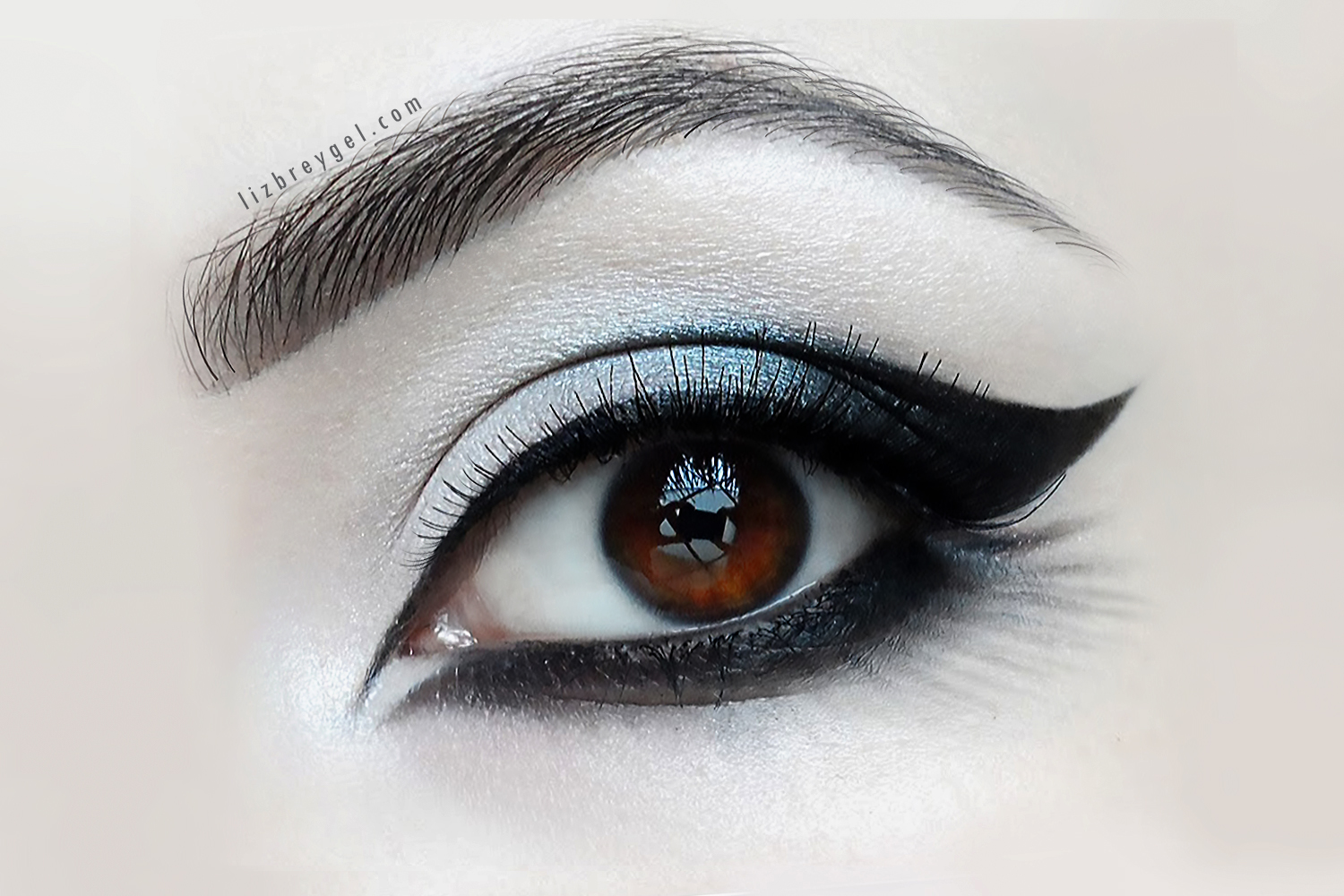 a close-up picture of an eye with a beautiful and dramatic gothic makeup look