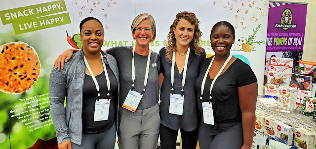 group photo at the Mary's Gone Crackers booth at Natural Products Expo East