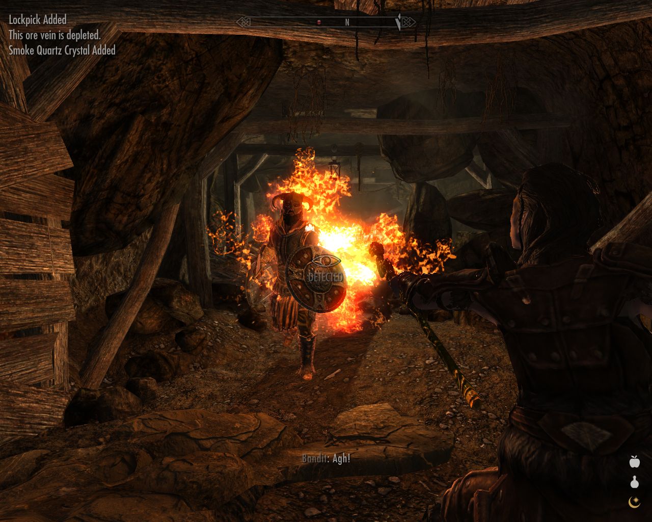 wide passage in a dungeon, Jenassa is using a magic staff to cast fire at a bandit who approaches running