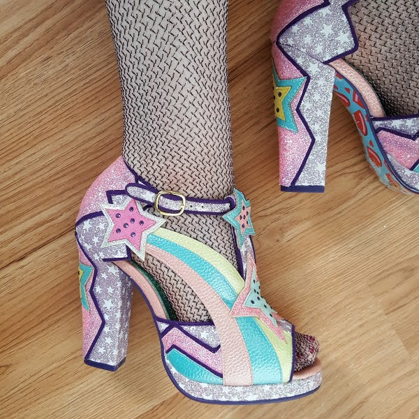 wearing pastel Irregular Choice shoes in star print glitter
