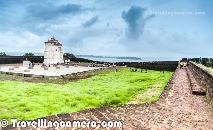 Aguada Fort is very popular destination for tourists in goa. It's not only about tourists who love thials place but localities and Bollywood keeps showing their love the place. Many of the bollywood movies are shot at this place and 'Rang de Basanti' is known the most among them. Aguada Fort looks awesome during monsoons and exposes to an amazing view of the sea from a high place. This Photo Journey shares some of the moments spent around Aguada Fort through Photographs. All of the Aguada Fort pictures in this Photo Journey are clicked during monsoon season. Aguada fort is very approachable from differentplaces in Goa like Panjim, Candolim, Calangule, Baga etc. The Fort Aguada is a very well preserved portuguese fort which is there in Goa for last few centuaries. This is actually located near Sinquerim Beach, overlooking the Arabian Sea around India. There is a working lighthouse inside this fort which you must have noticed in the first photograph as well in the photograph just above.  Aguada Fort is located around 20 kilometers from Panajim, the Old part of Goa.Almost every tourist who comes to Goa, visits Aguada Fort. Aguada Fort timings are 10:00 AM - 5:30 PM. It's open on all days of the week. I thought of sharing timings here because, before coming to Aguada Fort we checked for two things - Timings & it's location on Map. Aguada fort map is much needed becausin Goa, you get different information about this fort from different sources. We realized that the name Aguada is used by many properties and many times people may guide you to some property.The Aguada fort was constructed in 16th centuary to guard this land against the Dutch and the Marathas. Aguada was a reference point for the vessels coming from Europe in old days. Aguada is an old Portuguese fort which is on south of Candolim beach and stands at the shore of the Mandovi River.Above photogrph shows amazing views of Arabic Sea... As shown in bollywood movie 'Rang de Basanti', this place expose tourists to some of the unique views & experiences of Goa. We went there in morning and found it best time to visit. Usually Aguada Fort is very crowded with tourists, so it's recommended to reach there early, which essentially means 10 am and explore the place. After our visit to Aguada Fort, we drove to the beach which was near Goa Jail. Many of the folks were doing fishing there and we saw hundreds of crabs on the beach. This was an awesome experience and we shall dedicate a separate Photo Journey to those crabs :)Many times, Goans confuse the fort with Aguada fort Taj which comes on the way to the fort and it's one of the most popular properties to stay in Goa. Apart from that many folks visit Vivanta by Taj and beaches around it. It has also become one of the main tourist destination. There are few fort like structures around Vivanta where tourists like to visit to witness high tides of the seaName of Aguada Fort is taken from freshwater spring which used to suppy water to the ships coming there. 'Agua' in actually a portuguese means water, and hence the fort was named 'Aguada' to denote a place where water is accumulated. There was time when fort was protected by more than 200 cannons and a deep dry moat, which one still has to cross to get inside. More details about history of this fort can be checked at - http://www.goatourism.gov.in/destinations/forts/150-aguada-fortFort has multiple levels and one needs to climb stairs to explore fort, so it's not recommended for folks having trouble in climbing high places and in general one needs to walk a lot to explore the fort. It seems that the land around the fort is now owned by The Indian Hotels Company. On the ramparts behind the fort is the Fort Aguada Beach Resort. This property is owned by Tatas and is part of an 85+ acres complex overlooking the Arabian Sea. It is situated on Sinquerim Beach and looks beautiful from road. Fort Aguada Beach Resort looks awesome with beautiful villas and cottages, with unmatchable views of Arabian sea.We didn't spend much time around Aguada Fort, as the list to do was long and there were many more exciting things in our mind. But it was wroth visiting Aguada Fort for short splan of time... On the back journey we noticed a beautoful beach with lot of ships parked there and planned to visit the same. It was Coco beach and following link shares the exciting experience with fishermen on the Coco Beach.