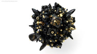 Adorable black with gold sparks beaded ball charm