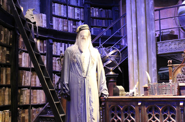 A picture of Albus Dumbledore's office and the sorting hat from Harry Potter