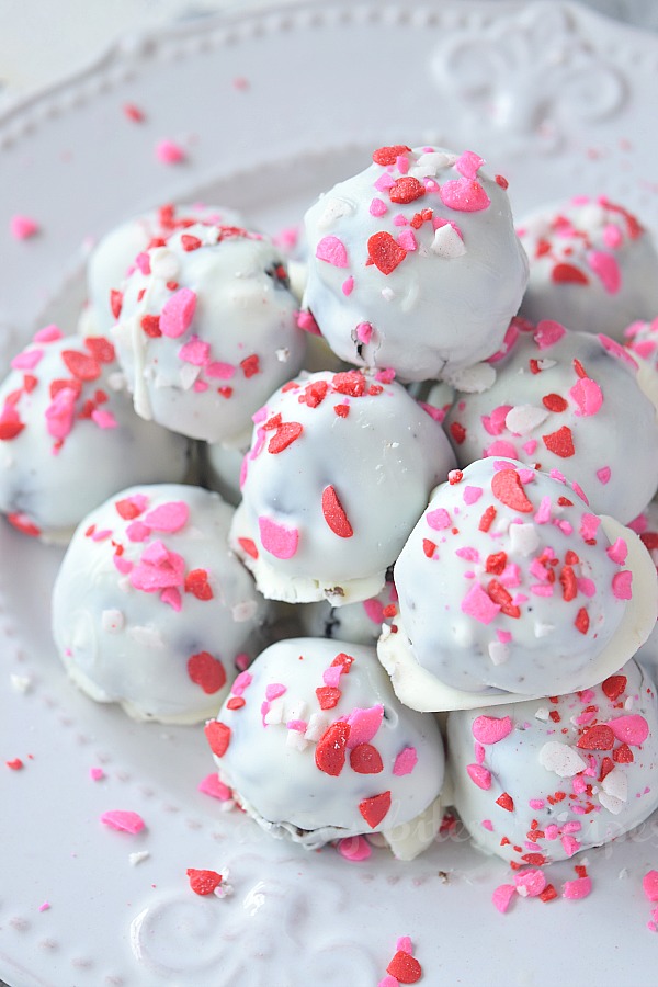 top view of a white plate with christmas oreo cookie balls