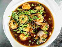 Serving chicken manchurian gravy in a bowl