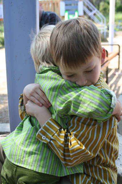 Matti and Anton hugging both wearing Marimekko shirts.