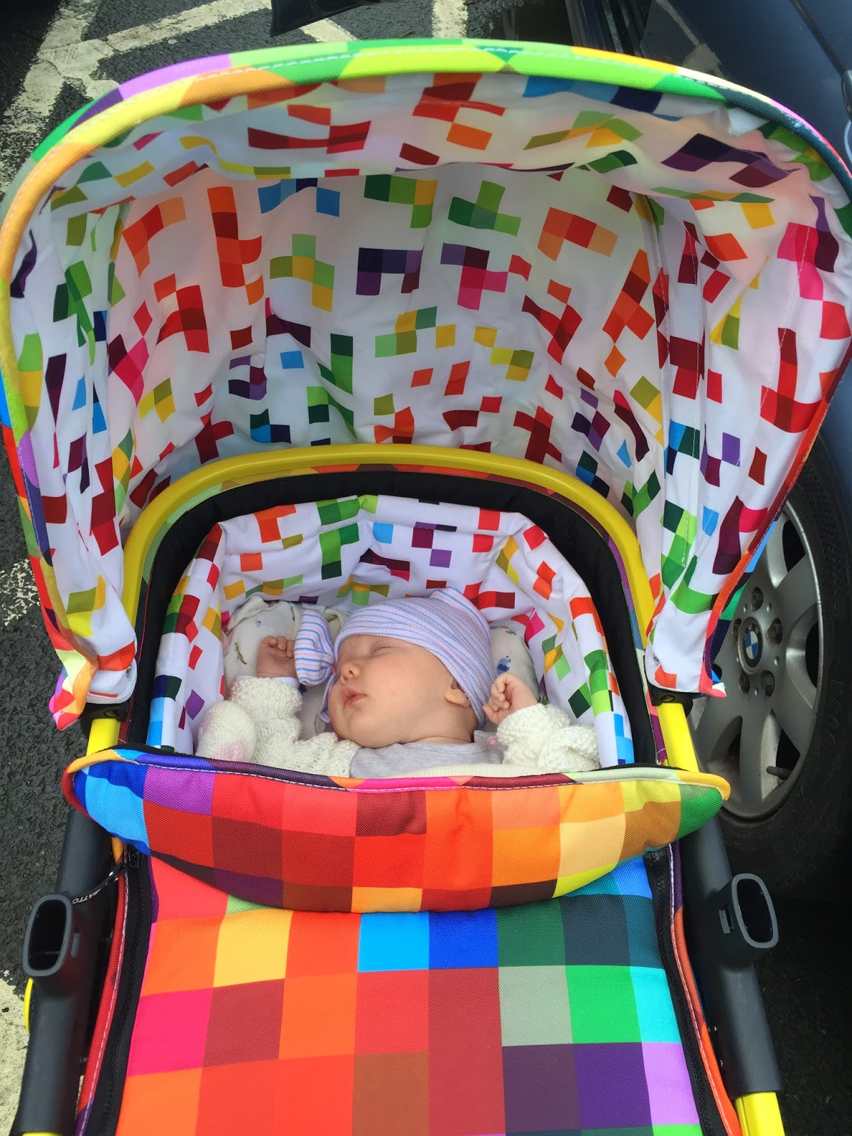 Bright coloured baby pram