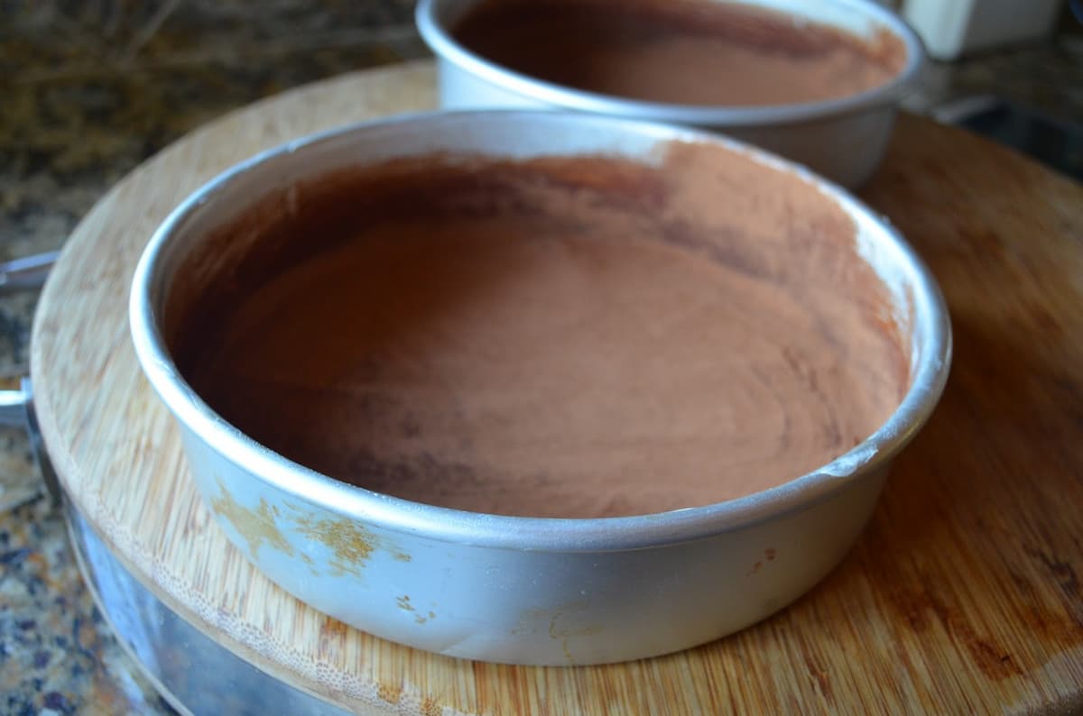 Cake Pans dusted with cocoa powder.