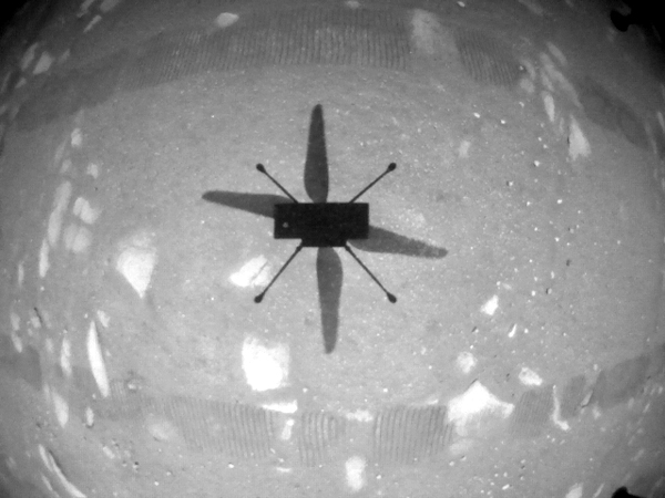 A camera underneath Ingenuity's fuselage took this photo of the helicopter's shadow as the vehicle made its historic first flight on Mars...on April 19, 2021. A camera underneath Ingenuity's fuselage took this photo of the helicopter's shadow as the vehicle made its historic first flight on Mars...on April 19, 2021.