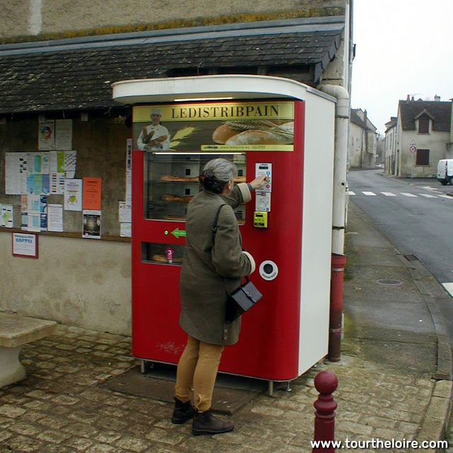 Using a baguette vending machine, Indre et Loire, France. Photo by Loire Valley Time Travel.