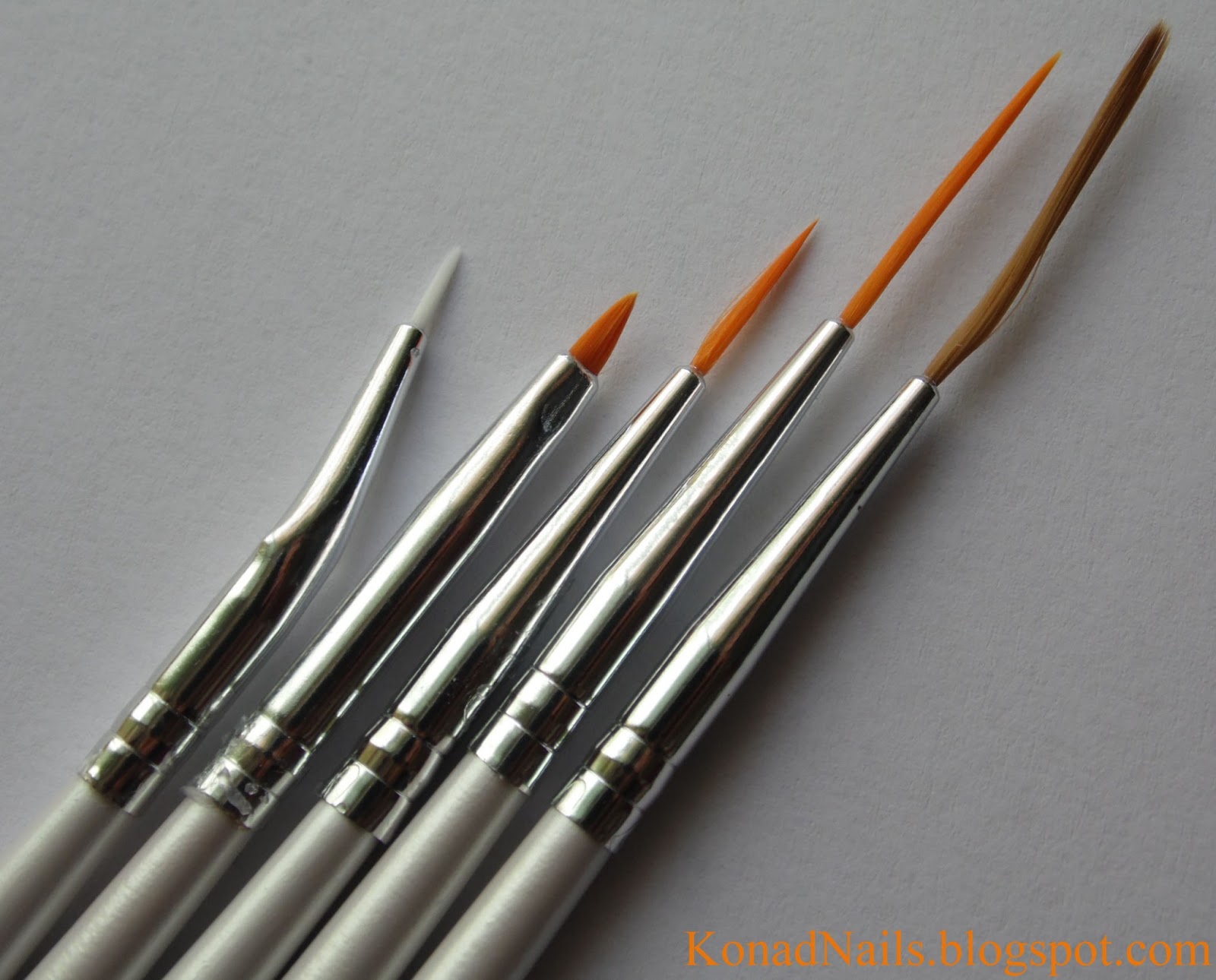 Konad Addict Striped nail art using fan brush
