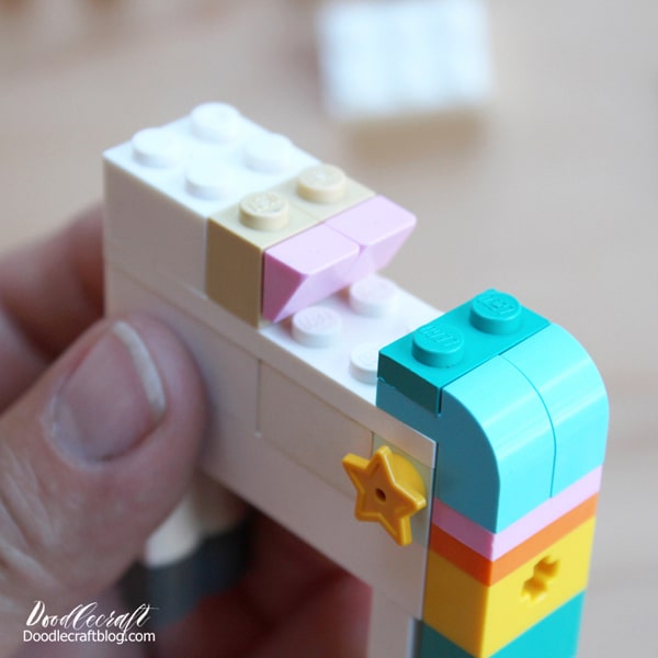 Star shaped Lego piece on the flank of the Unicorn lego build.