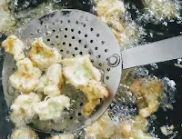 Deep frying Gobi Cauliflower florets for Gobi Cauliflower Manchurian recipe