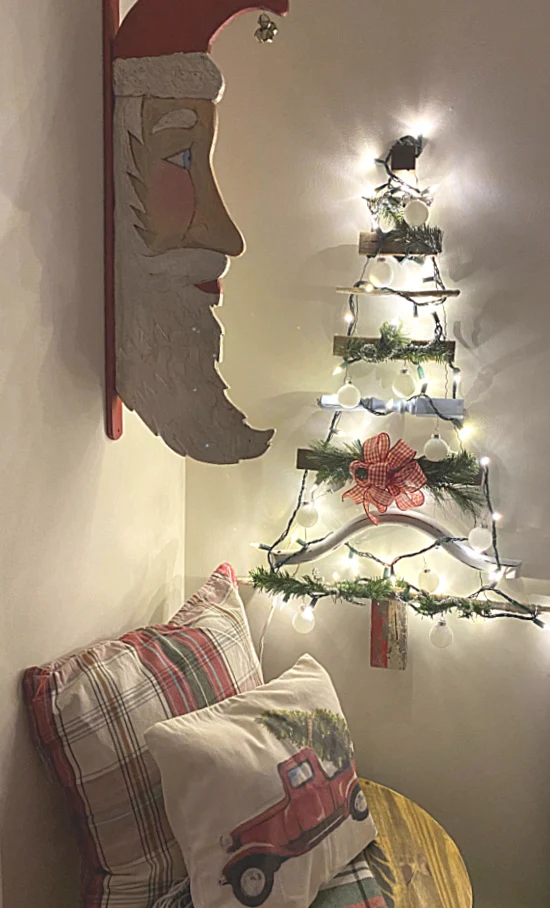 Light up tree on the wall and a Santa Claus