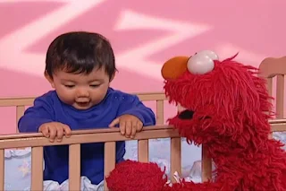A baby sleeps in crib. But Elmo says the baby in the crib wants to stay awake. Sesame Street Elmo's World Sleep Kids and Baby