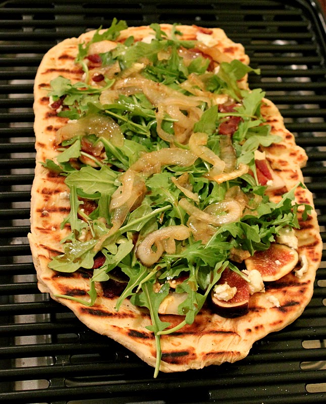 the swell quenelle fig, pear and arugula grilled goat cheese flatbread
