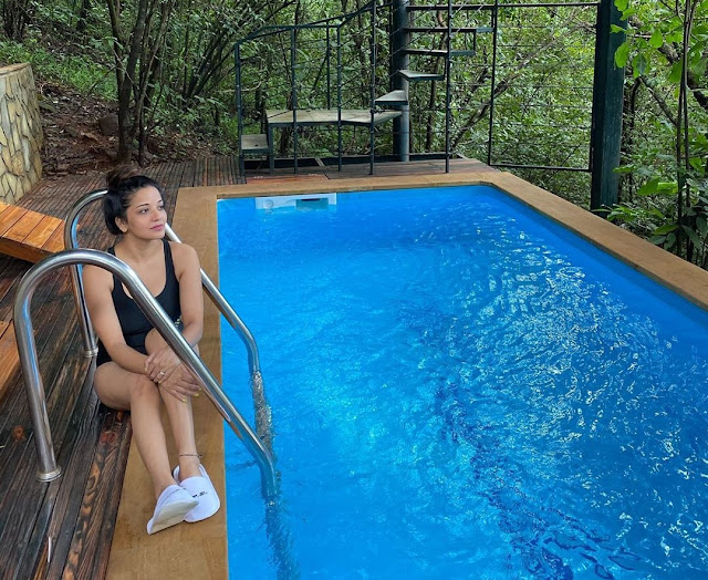 Monalisa looks enchanting in black monokini as she takes a dip in pool- newsdezire