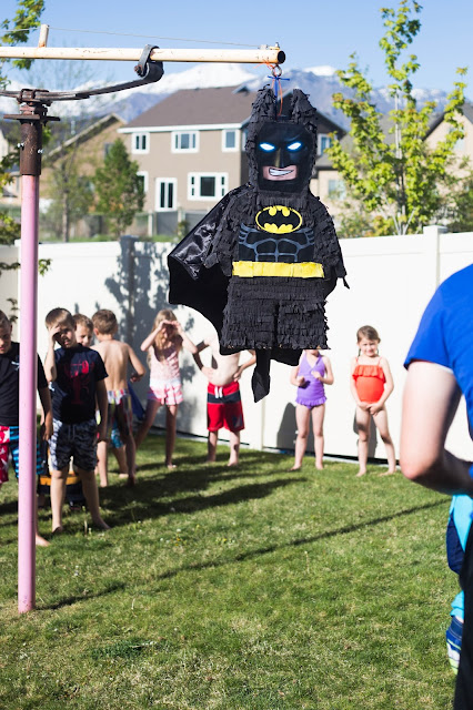 lego batman piñata activity during birthday party