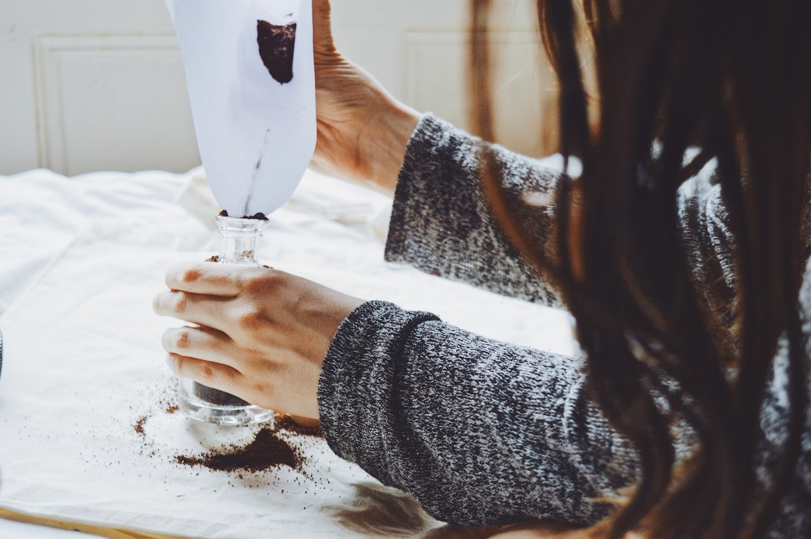 pouring coffee into bottle
