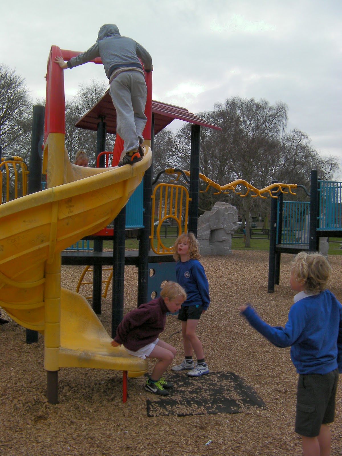 i am the king of the world boys climbing up curly yellow slide boys walking up a slide milton park portsmouth