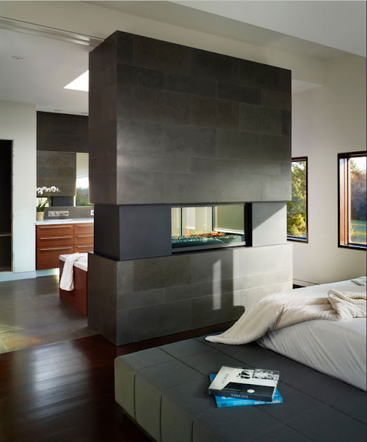 Schlafzimmer-mit-kamin-doppelseitige-beton-Fliesen-Design