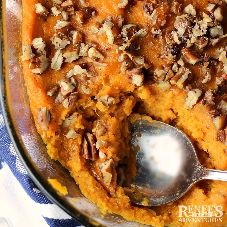 Overhead view of Sweet Potato Souffle Casserole by Renee's Kitchen Adventures with spoon in casserole