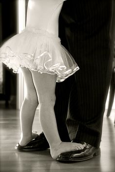 Father and daughter foot dancing together | photofun4ucom