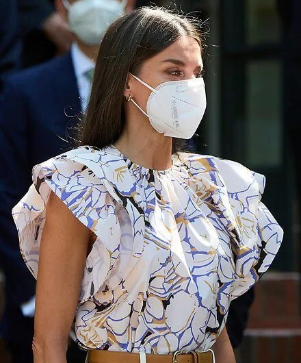 Queen Letizia wore a new double sleeve ruffle top from Psophia, and white suede espadrille wedges from Macarena, and Castaner wedges