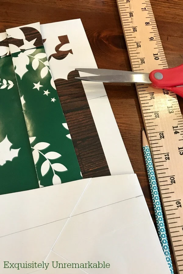 DIY Supplies for gift bag sign including bag, scissors, yard stick