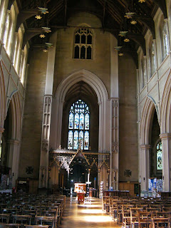 inside of large church sunlight on font