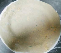 Rolling paratha dough for paneer paratha recipe