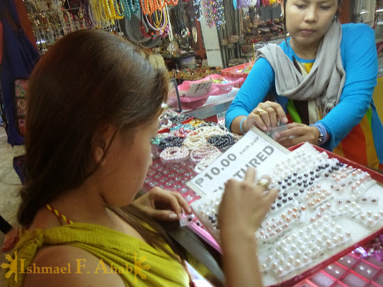 My Beloved Wife Lei buying pearl earrings in LRC Market Mall, Puerto Princesa