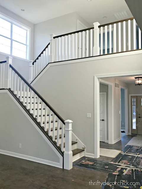 Open staircase with white spindles and balusters