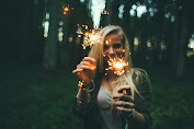 Girl play with fireworks in nature.