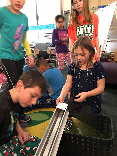 kids trying out maglev train on track